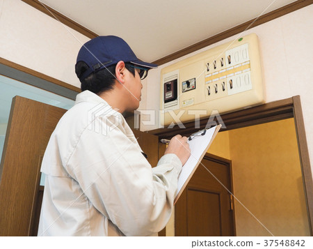 Worker checking the breaker 37548842