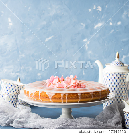 Bundt cake with frosting. Festive treat flowers Bundt cake with frosting. Festive treat flowers 37549320