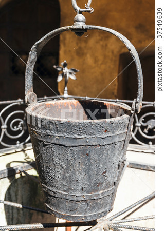 A water well with an old bucket, close up 37549639