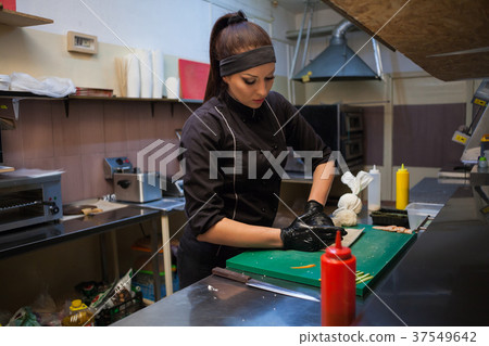 the Cook woman prepares food sushi restaurant the Cook woman prepares food sushi restaurant 37549642