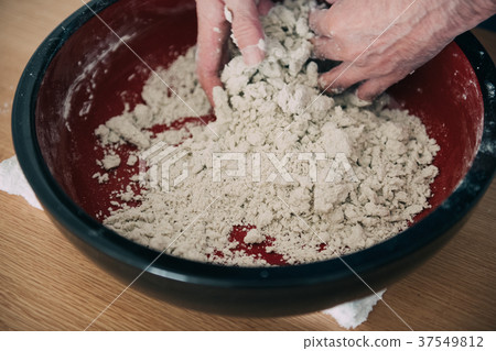 Hand of man making buckwheat noodles 37549812