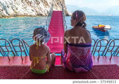 Mother and young daughter are traveling in the Mother and young daughter are traveling in the 37549813