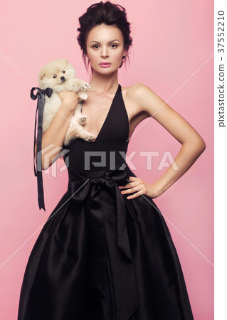 Fashion beautiful woman in black dress with bow Fashion beautiful woman in black dress with bow 37552210