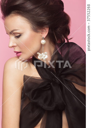 Fashion beautiful woman in black dress with bow Fashion beautiful woman in black dress with bow 37552268
