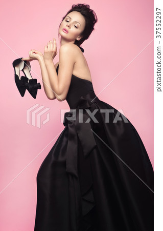 Fashion beautiful woman in black dress with bow Fashion beautiful woman in black dress with bow 37552297