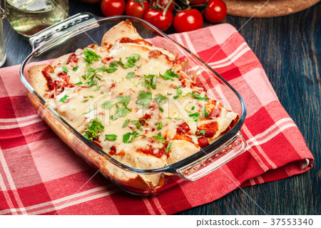 Traditional mexican enchiladas with chicken meat Traditional mexican enchiladas with chicken meat 37553340