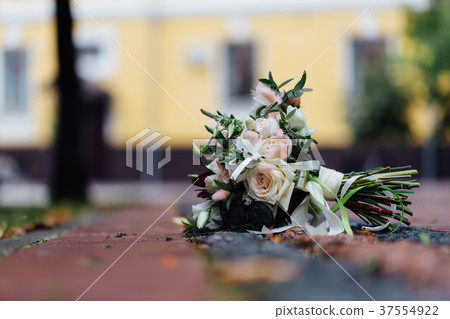 wedding bouquet on the pavement in the street. No 37554922