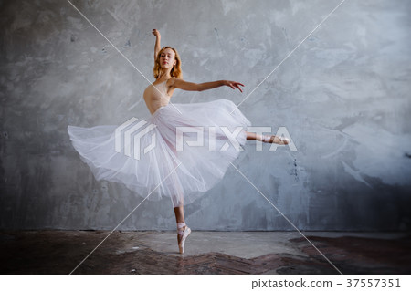 Young slim ballerina is posing in stylish studio 37557351