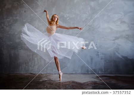 Young slim ballerina is posing in stylish studio 37557352