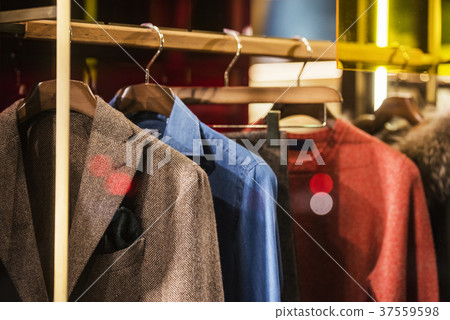 Men elegant clothing on hangers in a store 37559598