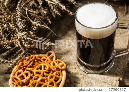 Mug beer with wheat and basket of pretzels on Mug beer with wheat and basket of pretzels on 37560837