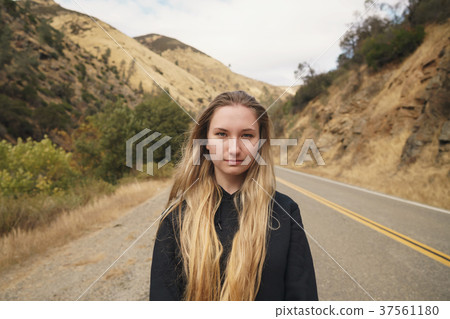 teen girl standing on road near merced river on 37561180