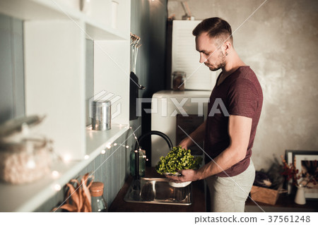 Man in the kitchen. Cooking time. Rustic color Man in the kitchen. Cooking time. Rustic color 37561248