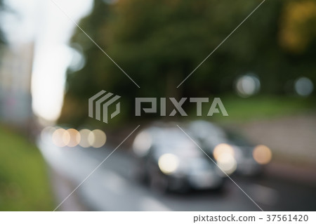 bokeh blur of cars moving on europe city street 37561420