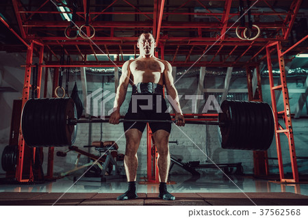 Muscular fitness man doing deadlift a barbell in 37562568