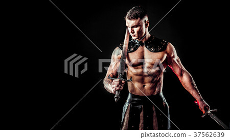 Severe barbarian in leather costume with sword 37562639