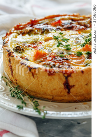Quiche with salmon, broccoli,red pepper and thyme. Quiche with salmon, broccoli,red pepper and thyme. 37566060