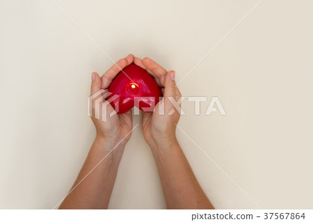 Hands holding heart 37567864