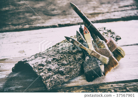 Set brushes on wooden surface with, vintage 37567901