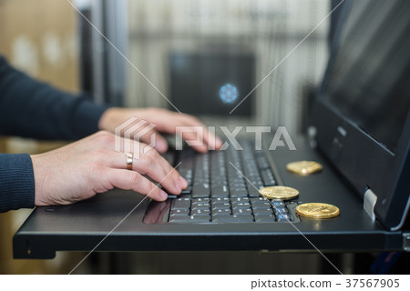 Bitcoin, litecoin ethereum on laptop, golden coins Bitcoin, litecoin ethereum on laptop, golden coins 37567905