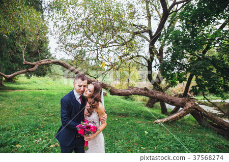 Happy bride and groom on their wedding 37568274