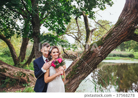 Happy bride and groom on their wedding Happy bride and groom on their wedding 37568278