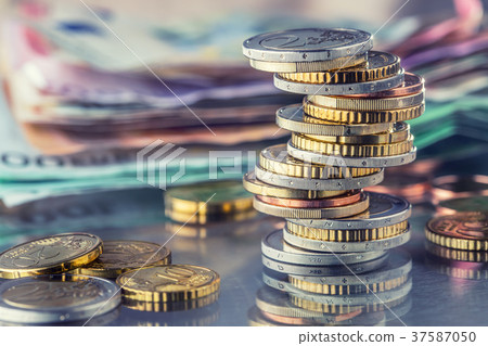 Euro Coins stacked on each other in positions. Euro Coins stacked on each other in positions. 37587050