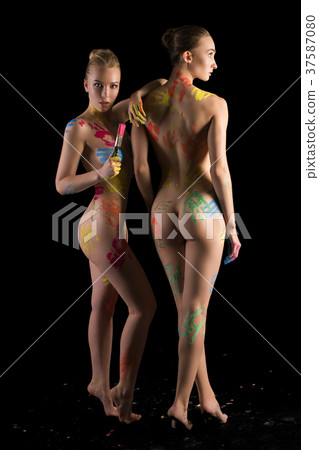 Two nude girls with colorful bodyart isolated shot Two nude girls with colorful bodyart isolated shot 37587080