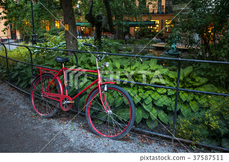 old red bike near the fence 37587511
