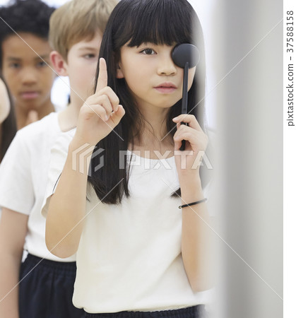 Primary school student medical checkup eyesight examination 37588158
