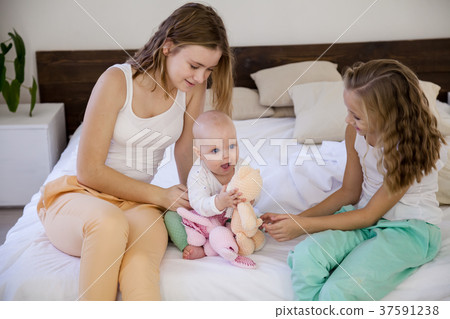 three girls play sisters in the morning in the 37591238