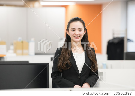 Smiling businesswoman office scene 37591388