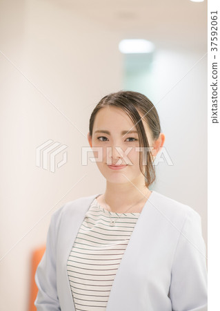 Young woman working in office Young woman working in office 37592061