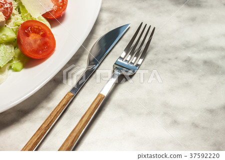 fresh vegetables salad on white plate 37592220