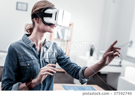 Attentive female person raising both arms 37592740