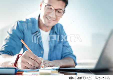 Diligent student preparing home assignment 37593790