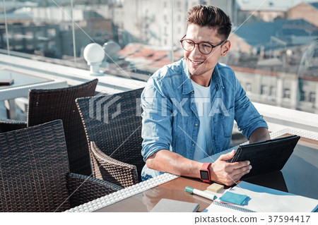 Dreamy young freelancer thinking of something and Dreamy young freelancer thinking of something and 37594417