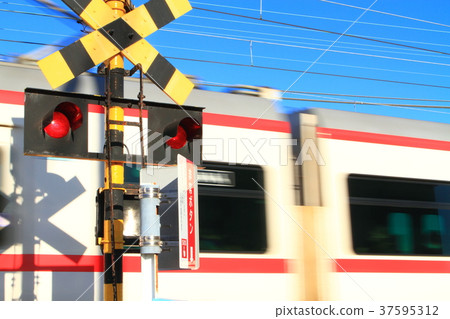 A train passing through a railroad crossing A train passing through a railroad crossing 37595312