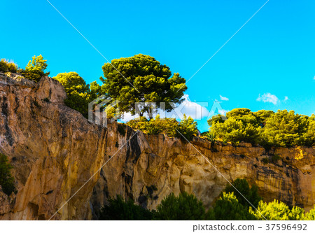 great rock wall, cliff against the blue sky great rock wall, cliff against the blue sky 37596492