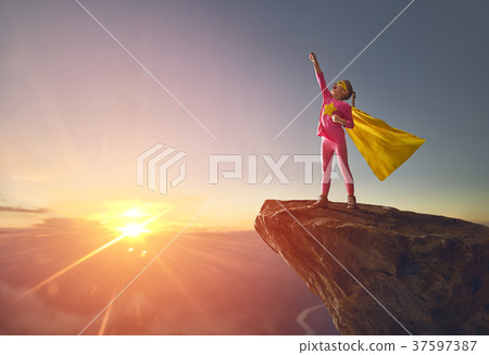 child is playing superhero 37597387