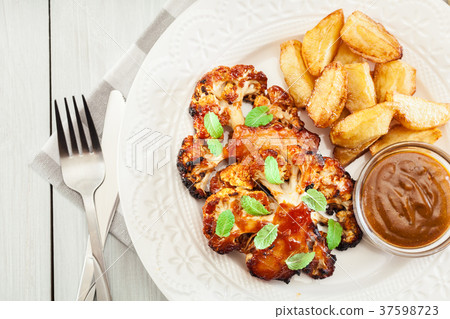 Vegetarian roasted cauliflower steak with herbs 37598723