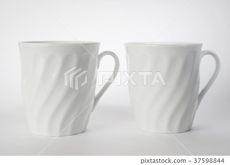 Composition of two white tea mugs Composition of two white tea mugs 37598844