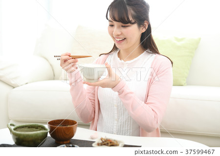 Woman eating home food Woman eating home food 37599467