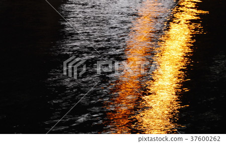 blurry of artificial light pole on canal in night blurry of artificial light pole on canal in night 37600262