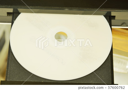 DVD put on insert disc player in wooden cupboard 37600762