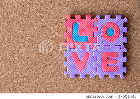 Colorful toy foam alphabet in word love on cork Colorful toy foam alphabet in word love on cork 37601435