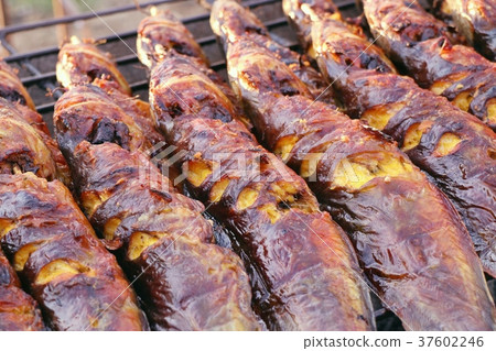 Grilled fish at the market Grilled fish at the market 37602246
