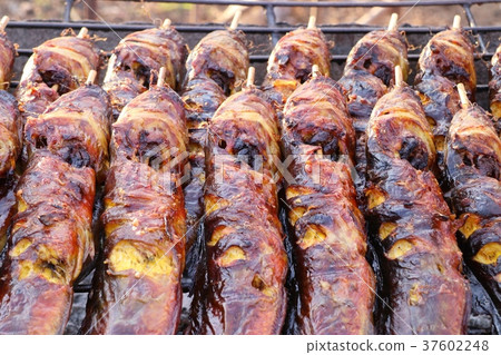 Grilled fish at the market Grilled fish at the market 37602248