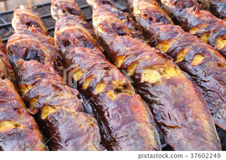 Grilled fish at the market Grilled fish at the market 37602249