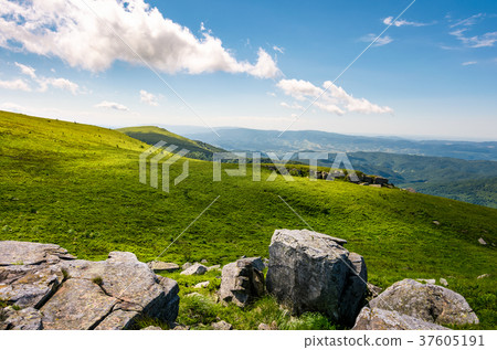 grassy slopes with huge rocks grassy slopes with huge rocks 37605191